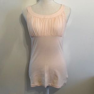 Pink tank top with rounded neckline and synched accent on bust. Size S.